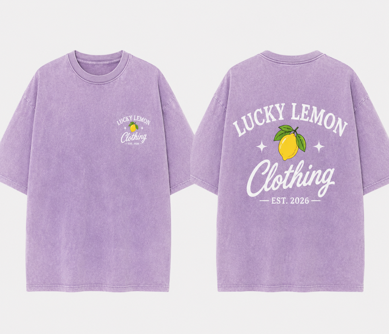 Lucky Lemon vintage wash lavender tee laid flat showing the front chest logo and full lemon back graphic
